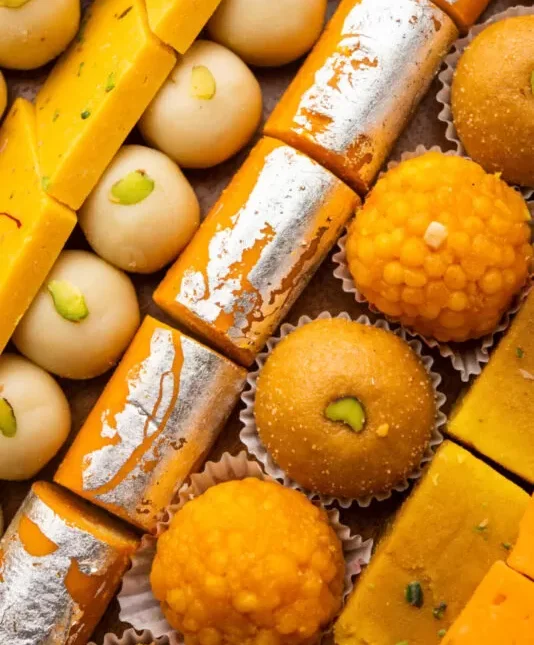 group indian assorted sweets mithai with diya 1 scaled e1723918605318